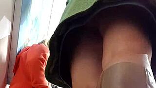 hidden cam catches upskirt action under her skirt.