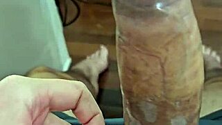 guy struggles with condom on thick penis