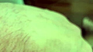 A young Brazilian amateur shows off his large penis and puts a condom on it