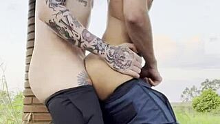 Young guys engage in gay sex outdoors in public square, visible to everyone passing by.