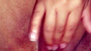 Woman masturbates with finger for intense orgasm.