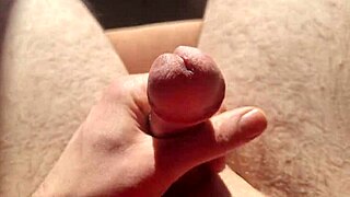 edging from flaccid and playing with precum natural light