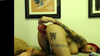 i'm this tattooed cam girl teasing with my dildo in pussy and ass