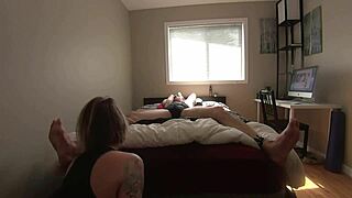 milf playfully teases her tied boyfriend's sensitive feet