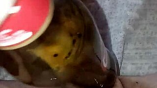 Pregnant Gretala rubs bottle on juicy pussy lips