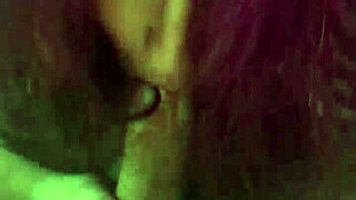 A curvaceous girlfriend with purple hair gives her friend a deep blow job