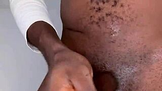 Watch the ninja man stroke his monster black cock until he cums?