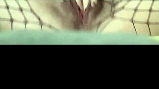 Young 18+ babe fingers herself to orgasm in sexy fishnets