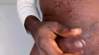 Watch the ninja man stroke his monster black cock until he cums?