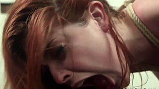 Busty Lesbian Dominates and Whips Redhead in Kinky Bondage Scene