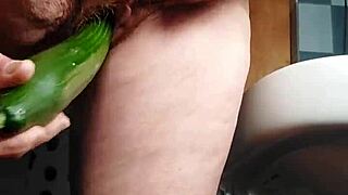 German Granny Slams Hairy Pussy with Cucumber in Kitchen