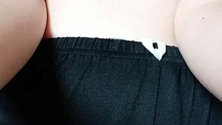 this pregnant milf spits on her big tits and nipples for fun