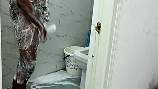 lucky asian guy showers with curvy irani milf, enjoying her huge assets. things get steamy fast.