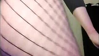 Curvy redhead flashes big ass pussy in fishnets