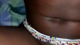 A black woman with big ass and tits poses casually