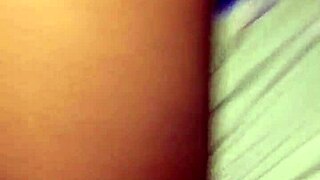 A black woman with big ass and tits poses casually