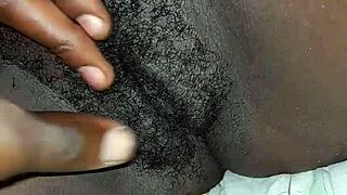 A black woman with big ass and tits poses casually