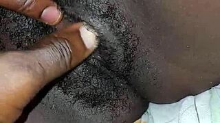 A black woman with big ass and tits poses casually