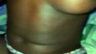 A black woman with big ass and tits poses casually