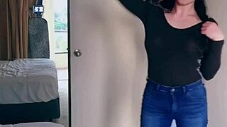 Pretty Asian ladyboy performs jeans striptease revealing gifted big boobs and ass