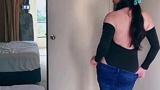 Pretty Asian ladyboy performs jeans striptease revealing gifted big boobs and ass