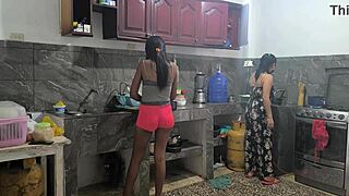 Housewives prepare lunch and touch each other sensually