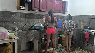 Housewives prepare lunch and touch each other sensually