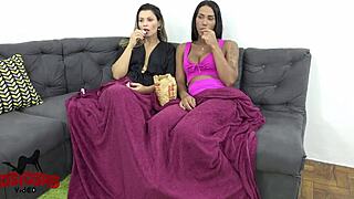 travesti in lingerie sits on milf's lap