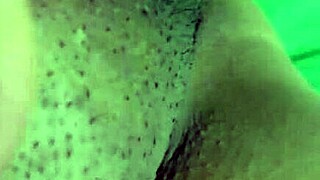 Mature woman masturbates shaved pussy alone at home