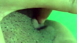 Mature woman masturbates shaved pussy alone at home