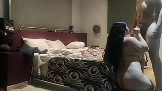 Double camera action in a steamy hotel room setup.