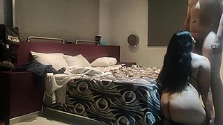 Double camera action in a steamy hotel room setup.