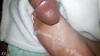 CUMSHOT Lands On OILED Feet In This Scene