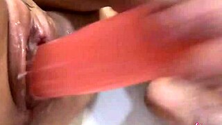 Beautiful girl plays with dildo in shower