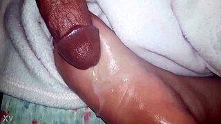 CUMSHOT Lands On OILED Feet In This Scene