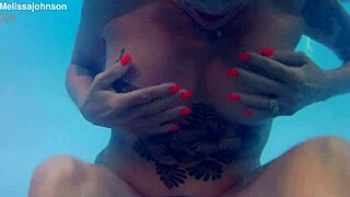 hey, melissa the mermaid with her tattoo and brown eyes is chilling by the pool today