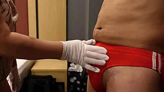 Dominant bitch slaps and kicks erect cock over tight blue bloomers for fun