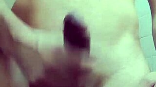 skinny guy with monster cock jerks off solo in the work bathroom, showing his small waist and big tool