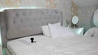 Student with big tits undresses after studying, teasing the camera.