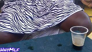 Housewife flashes shaved pussy at public bar, teasing voyeurs with her pretty outdoor seduction.