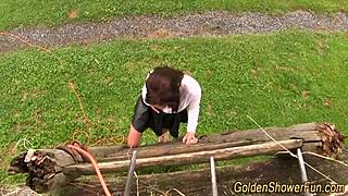 hey this bizarre skank gets peed on in outdoor golden shower