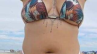 Flashing tiny panties on the beach to attract married guys for hot african fun