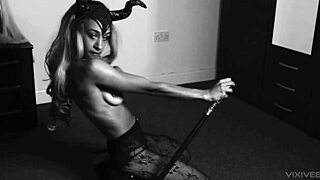 a horny ebony witch in fishnets teases and fucks herself with a cane using buttplug for double penetration on halloween