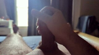 Sun rays hit homemade bedroom while masturbating big monster cock in close up