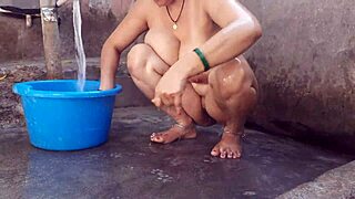 Look at this sexy big boobs bhabhi bathing outdoors?