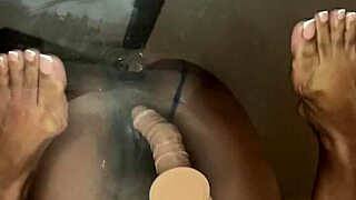 Ebony beauty explores pleasure by taking a dildo deep in her pussy on the desk. Her best friend watches as she rides it wildly with double penetration toys for ultimate satisfaction.