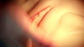 She fingers her lubricated pussy close up with cute shaved look.