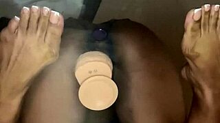 Ebony beauty explores pleasure by taking a dildo deep in her pussy on the desk. Her best friend watches as she rides it wildly with double penetration toys for ultimate satisfaction.