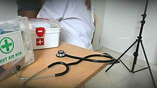 Doctor performs secret blowjob on patient in clinic setting.