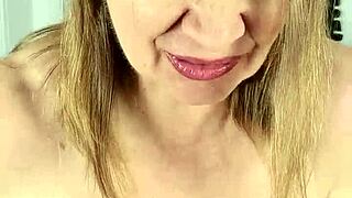 Stepmom strips for stepson gives blowjob and takes cumshot on huge natural tits